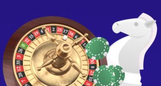 Roulette wheel, chips and a chess piece